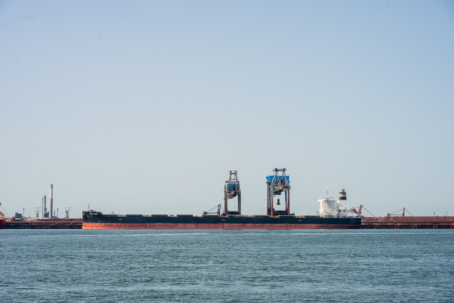 Bulk carrier alongside an industrial terminal berth
