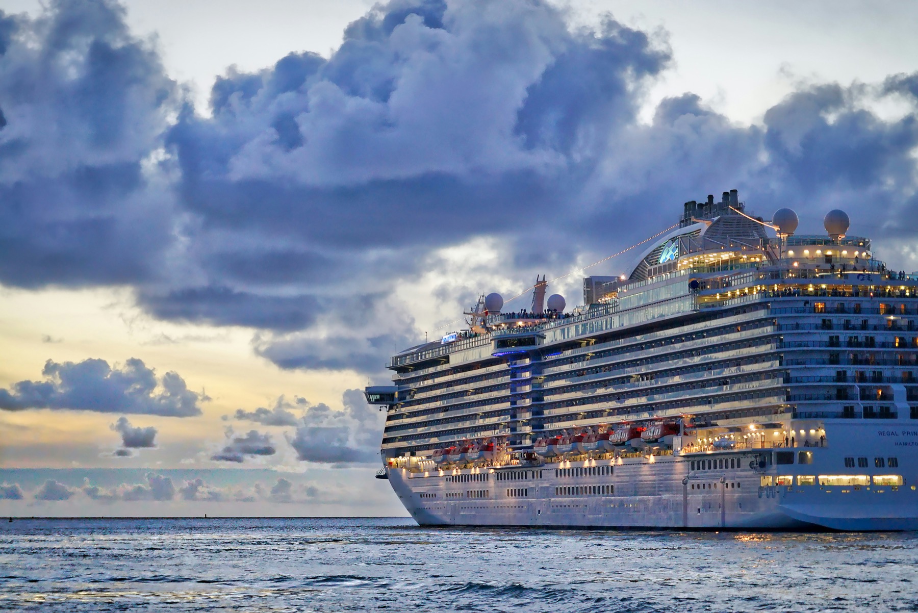 Large cruise ship underway at sunset