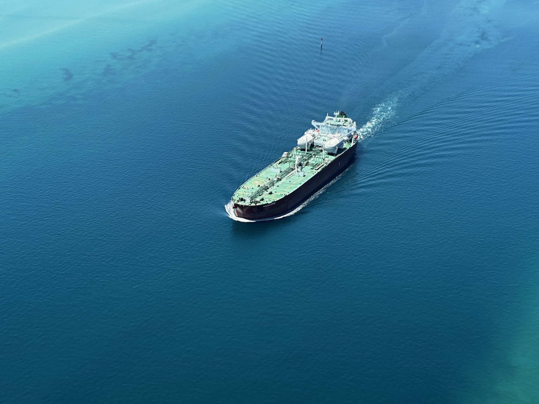 Green tanker vessel underway at sea